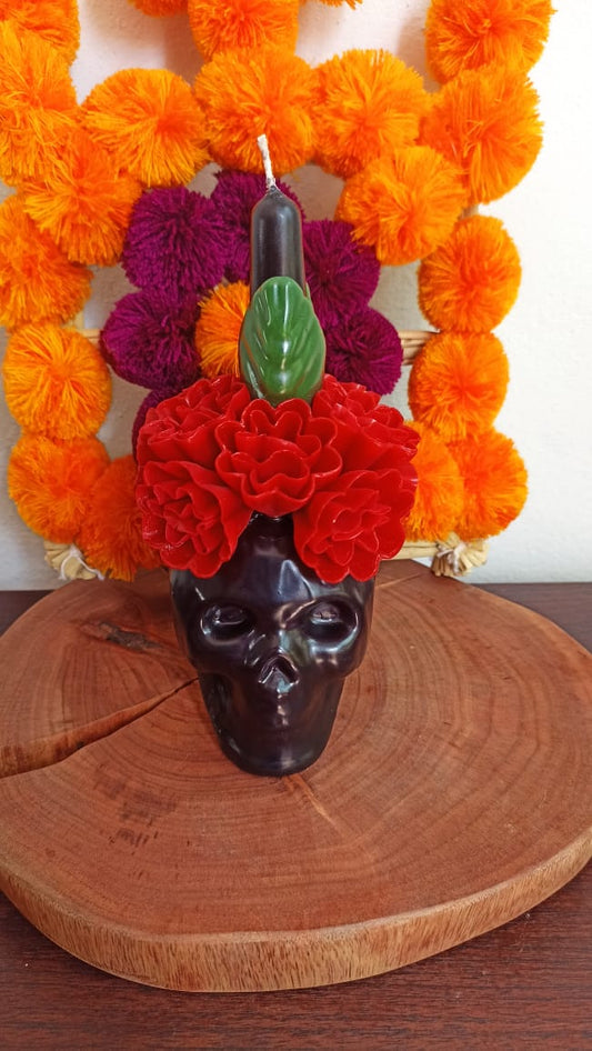 Vela de cráneo de flor roja colección día de muertos